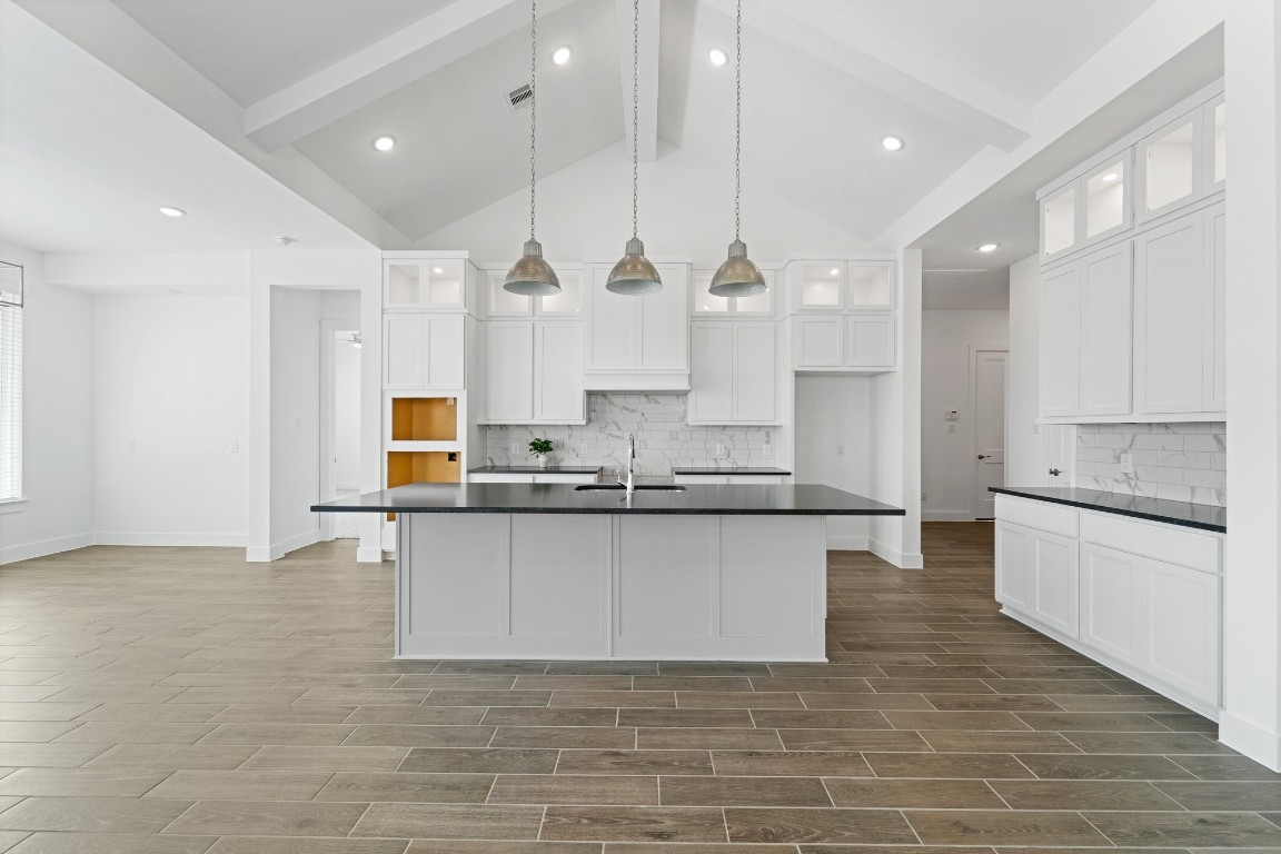 310 Blue River Trail Rosenberg, TX 77471 - Photo 16 of 47 a large kitchen with granite countertop a large counter top a sink stainless steel appliances and cabinets