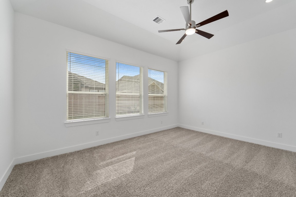 310 Blue River Trail Rosenberg, TX 77471 - Photo 20 of 47 an empty room with fan and windows