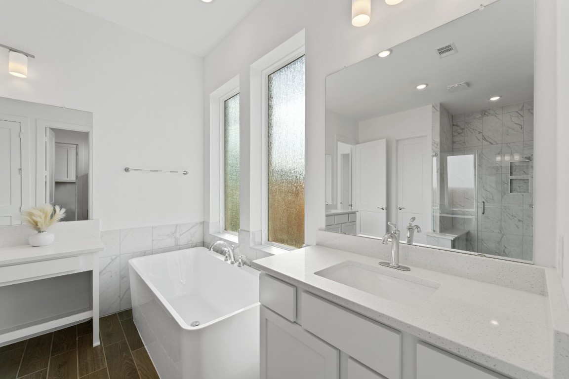 310 Blue River Trail Rosenberg, TX 77471 - Photo 24 of 47 a bathroom with a sink double vanity granite tub shower and a mirror