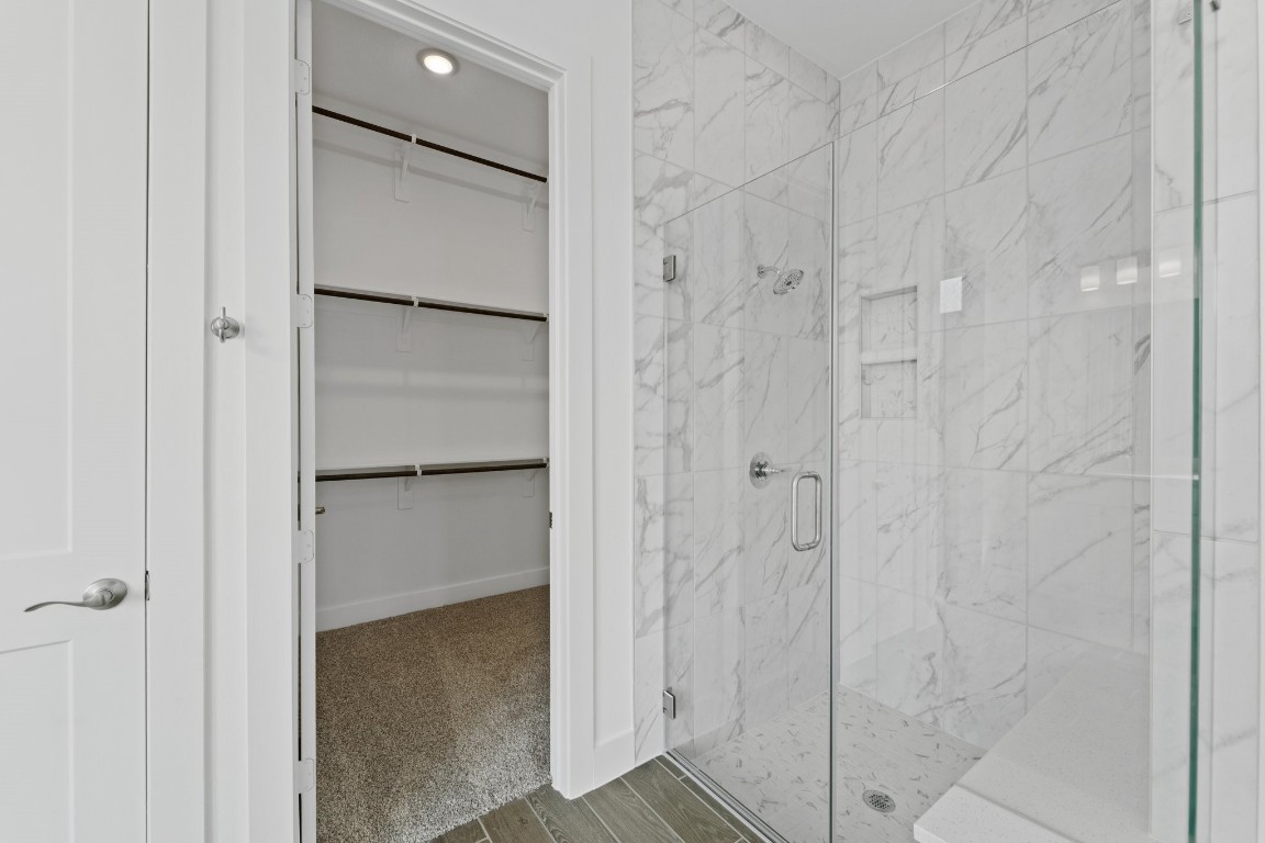 310 Blue River Trail Rosenberg, TX 77471 - Photo 25 of 47 a bathroom with a glass shower door