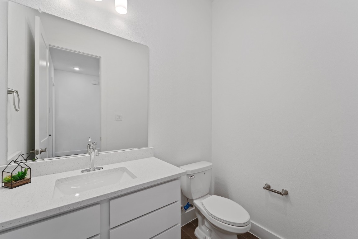 310 Blue River Trail Rosenberg, TX 77471 - Photo 29 of 47 a bathroom with a sink a toilet and a mirror