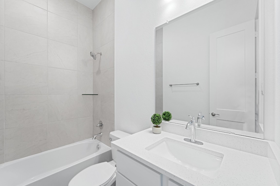 310 Blue River Trail Rosenberg, TX 77471 - Photo 6 of 47 a bathroom with a sink toilet and shower