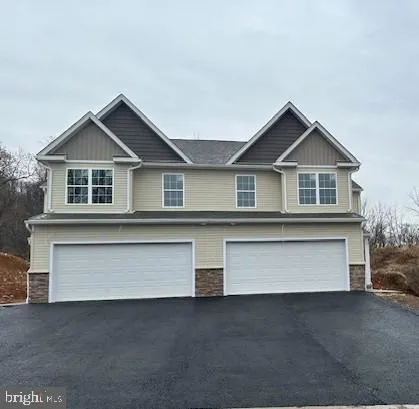 a front view of a house with a garage
