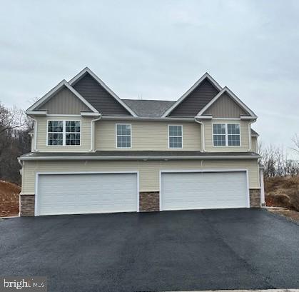 a front view of a house with a garage