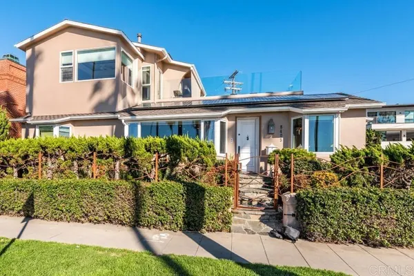 a living room with furniture a flat screen tv and a potted plant
