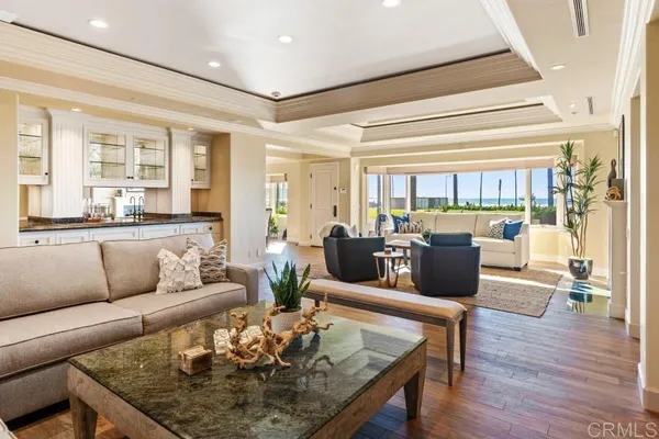 a kitchen with stainless steel appliances kitchen island granite countertop a sink counter space cabinets and a potted plant