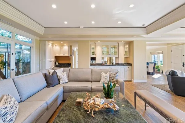 a kitchen with white cabinets and appliances