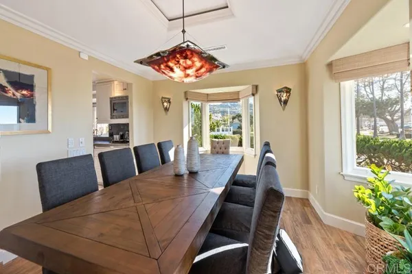 a bathroom with a granite countertop sink mirror and a bathtub