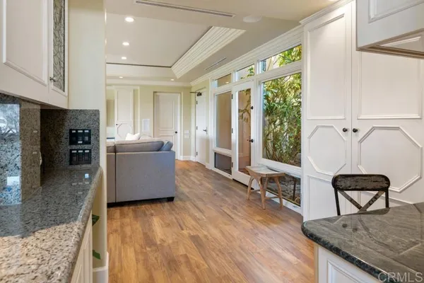 a spacious bedroom with a bed and a dresser