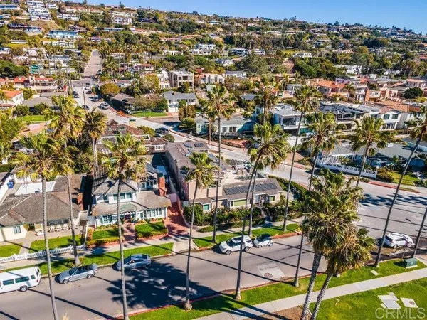 an aerial view of a house with a swimming pool