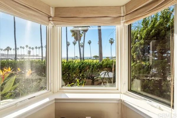 a spacious bedroom with a bed and a flat screen tv