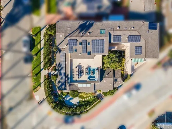 a living room with furniture fireplace and a large window