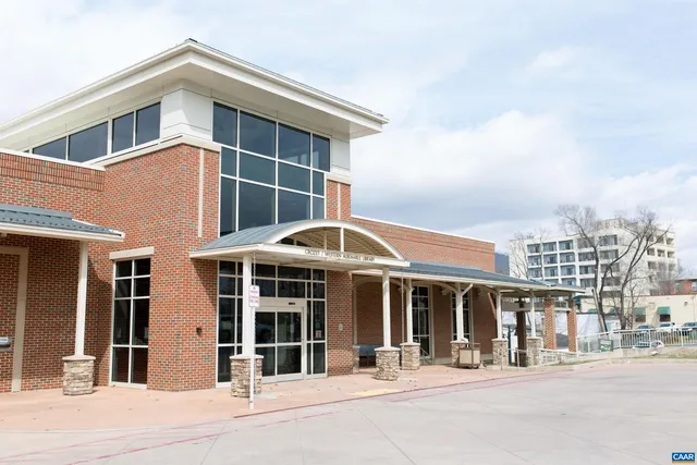 a view of a building with traffic signal