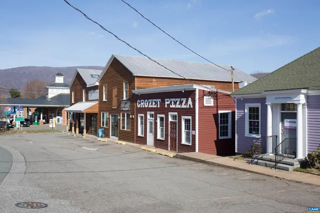 a play room with a table and chairs