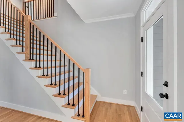 a view of entryway with wooden floor