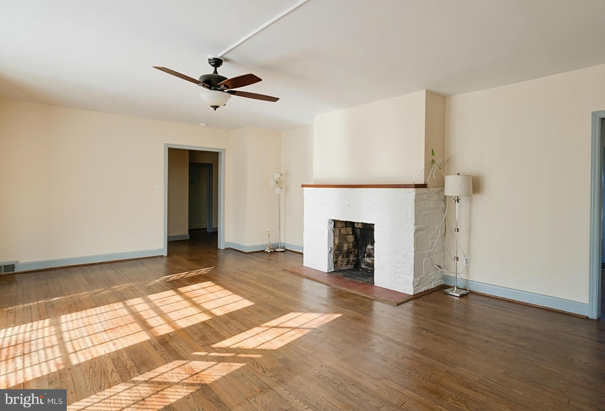 1 Dunmore Road Catonsville, MD 21228 - Photo 3 of 29 Main level living room with woodburning fireplace