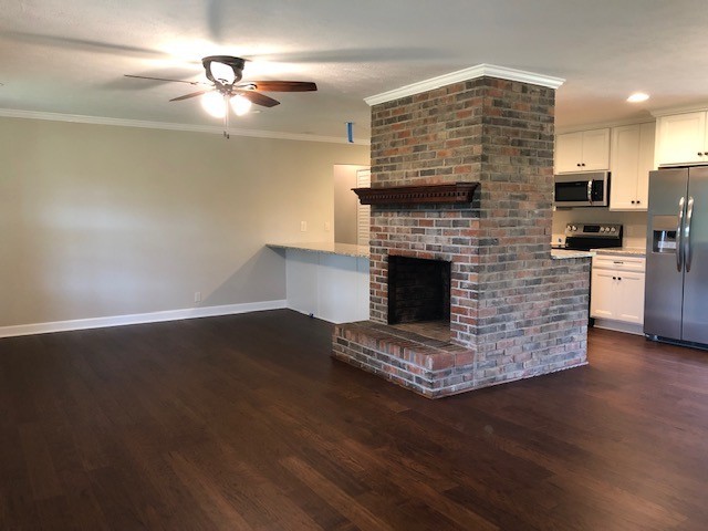 940 Harkreader Road Mount Juliet, TN 37122 - Photo 9 of 29 a living room with stainless steel appliances wooden floor and a fireplace