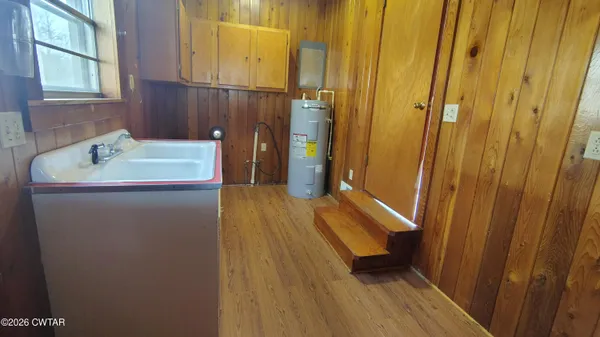 a bathroom with a sink a mirror and a toilet