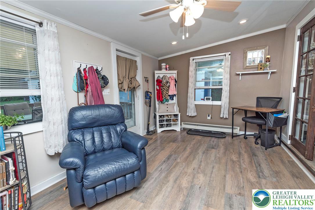 1114 Fox Gap Road Bangor, PA 18013 - Photo 35 of 63 Rich wood-inspired flooring and classic crown molding define this versatile home office and mudroom space.