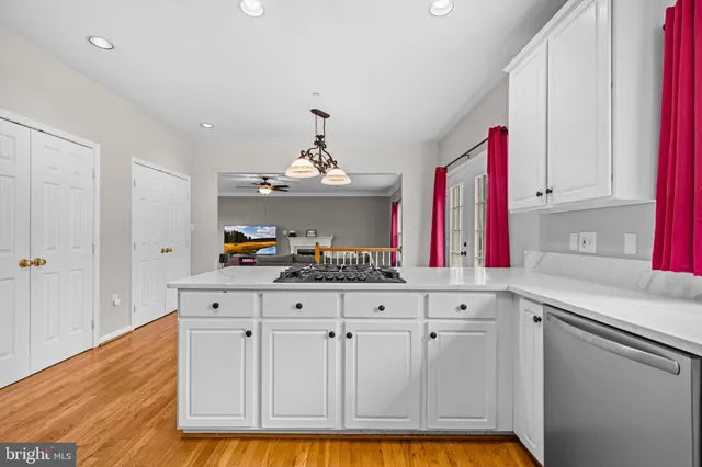 a bathroom with a double vanity sink a toilet and a window