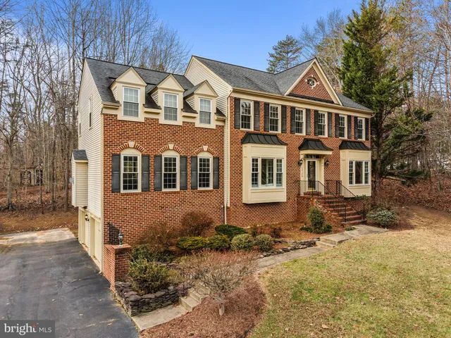 a view of a hallway with wooden floor and a hallway