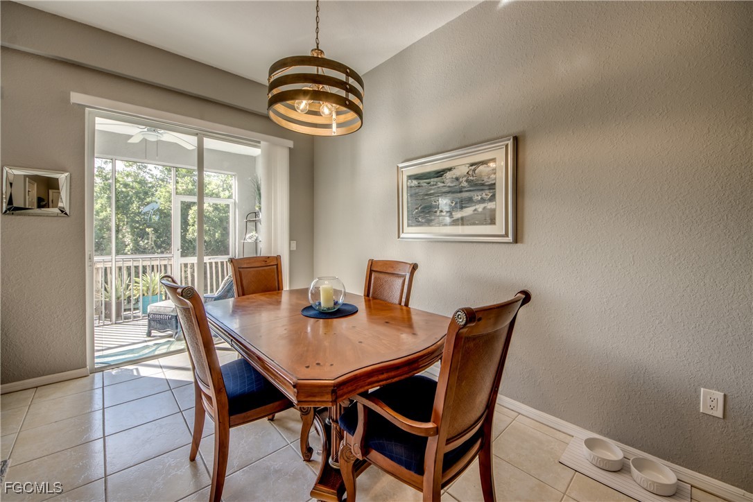 3181 Matecumbe Key Road, Unit 11 Punta Gorda, FL 33955 - Photo 17 of 50 a view of a dining room with furniture window and outside view