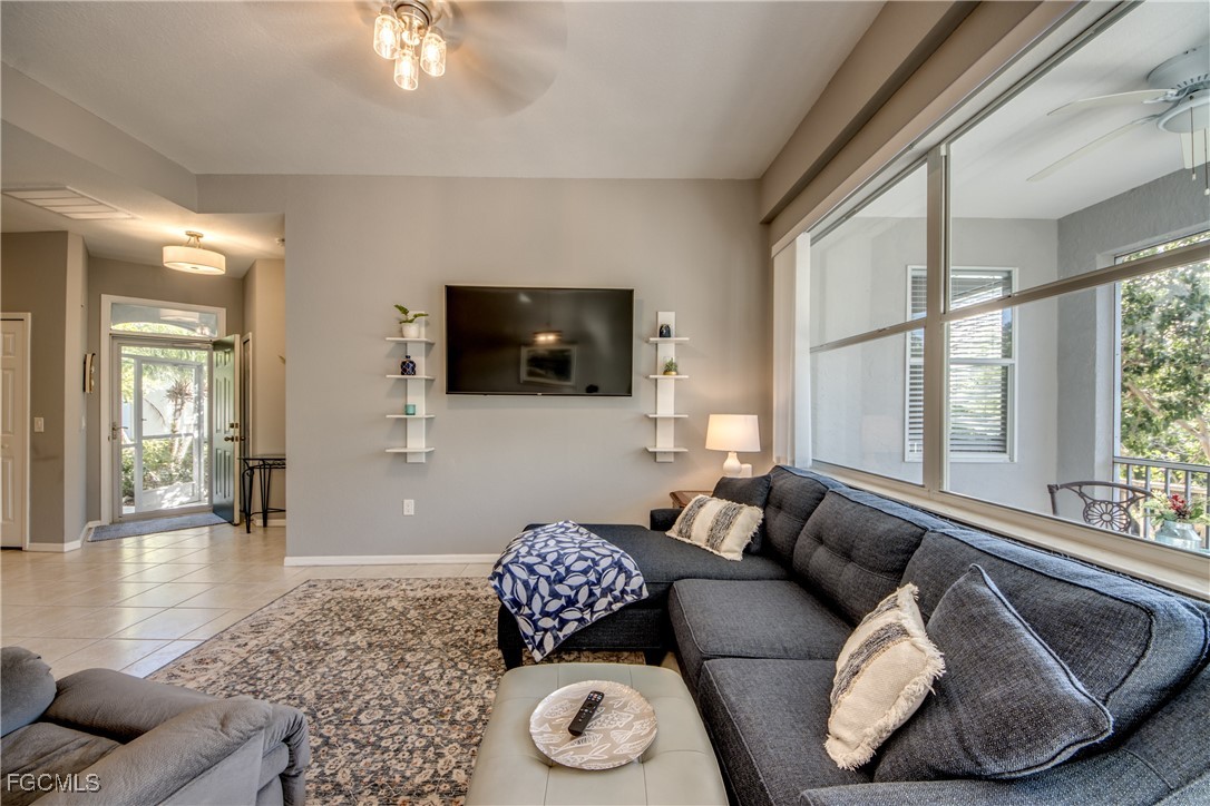 3181 Matecumbe Key Road, Unit 11 Punta Gorda, FL 33955 - Photo 20 of 50 a living room with furniture and a flat screen tv