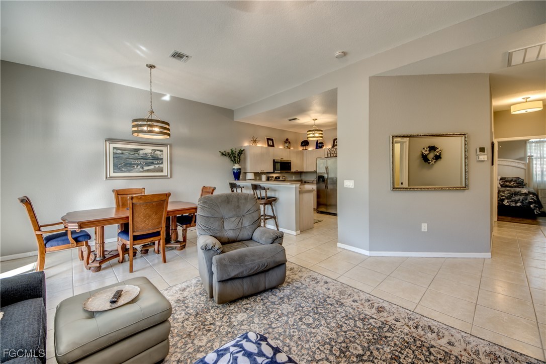 3181 Matecumbe Key Road, Unit 11 Punta Gorda, FL 33955 - Photo 21 of 50 a living room with furniture and wooden floor