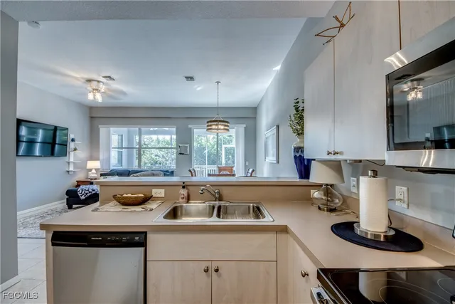 a spacious bathroom with a double vanity sink toilet and shower