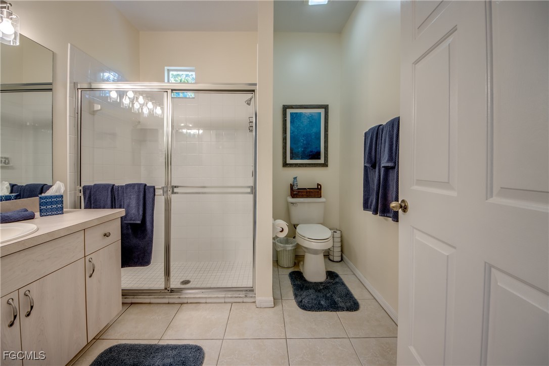 3181 Matecumbe Key Road, Unit 11 Punta Gorda, FL 33955 - Photo 35 of 50 a bathroom with a sink toilet and shower