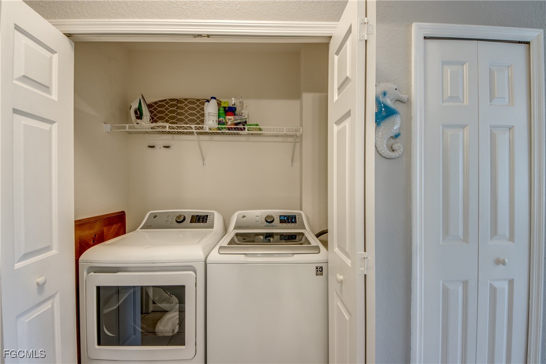 3181 Matecumbe Key Road, Unit 11 Punta Gorda, FL 33955 - Photo 39 of 50 a utility room with dryer and washer