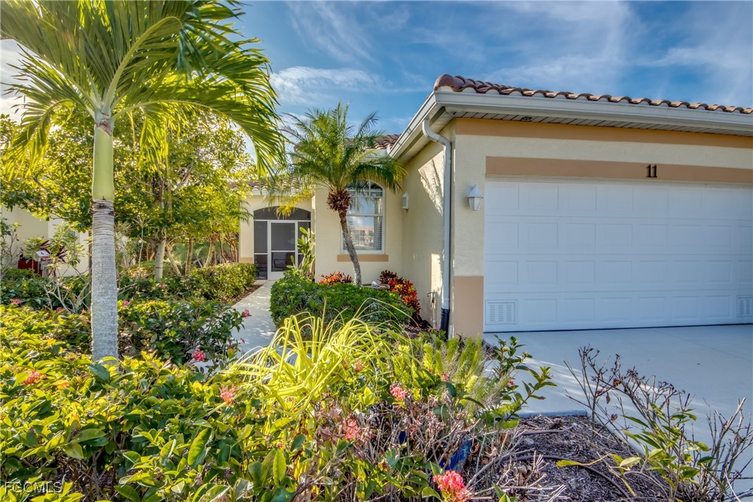 3181 Matecumbe Key Road, Unit 11 Punta Gorda, FL 33955 - Photo 4 of 50 a view of a house with a flower garden