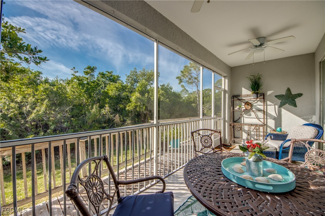 3181 Matecumbe Key Road, Unit 11 Punta Gorda, FL 33955 - Photo 42 of 50 a balcony with furniture and a potted plant
