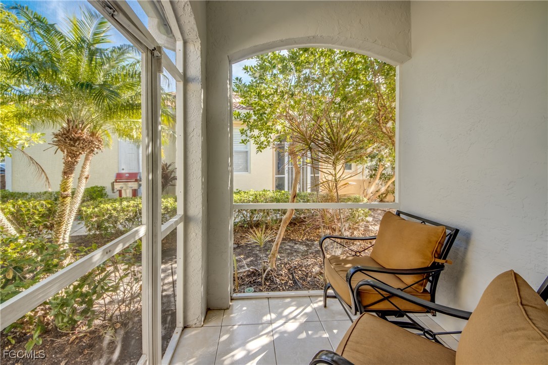 3181 Matecumbe Key Road, Unit 11 Punta Gorda, FL 33955 - Photo 6 of 50 a view of a balcony with chair and table