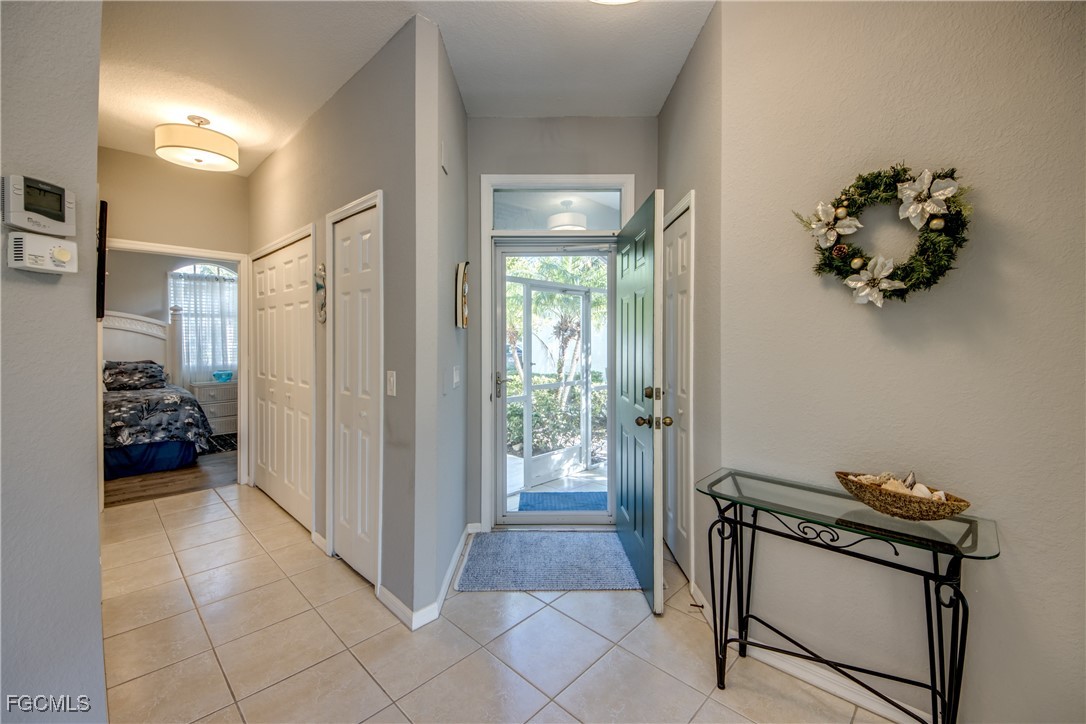 3181 Matecumbe Key Road, Unit 11 Punta Gorda, FL 33955 - Photo 8 of 50 a view of a hallway and a livingroom with furniture