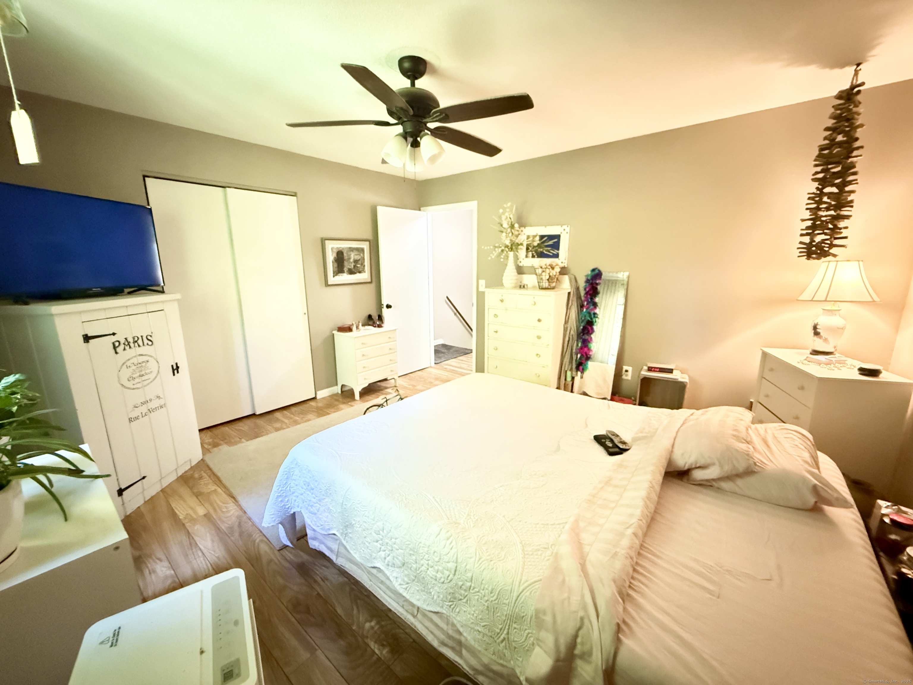 143 Pine Hill Road, Unit 15F Thomaston, CT 06787 - Photo 11 of 14 a bed room with a bed a window and a chandelier