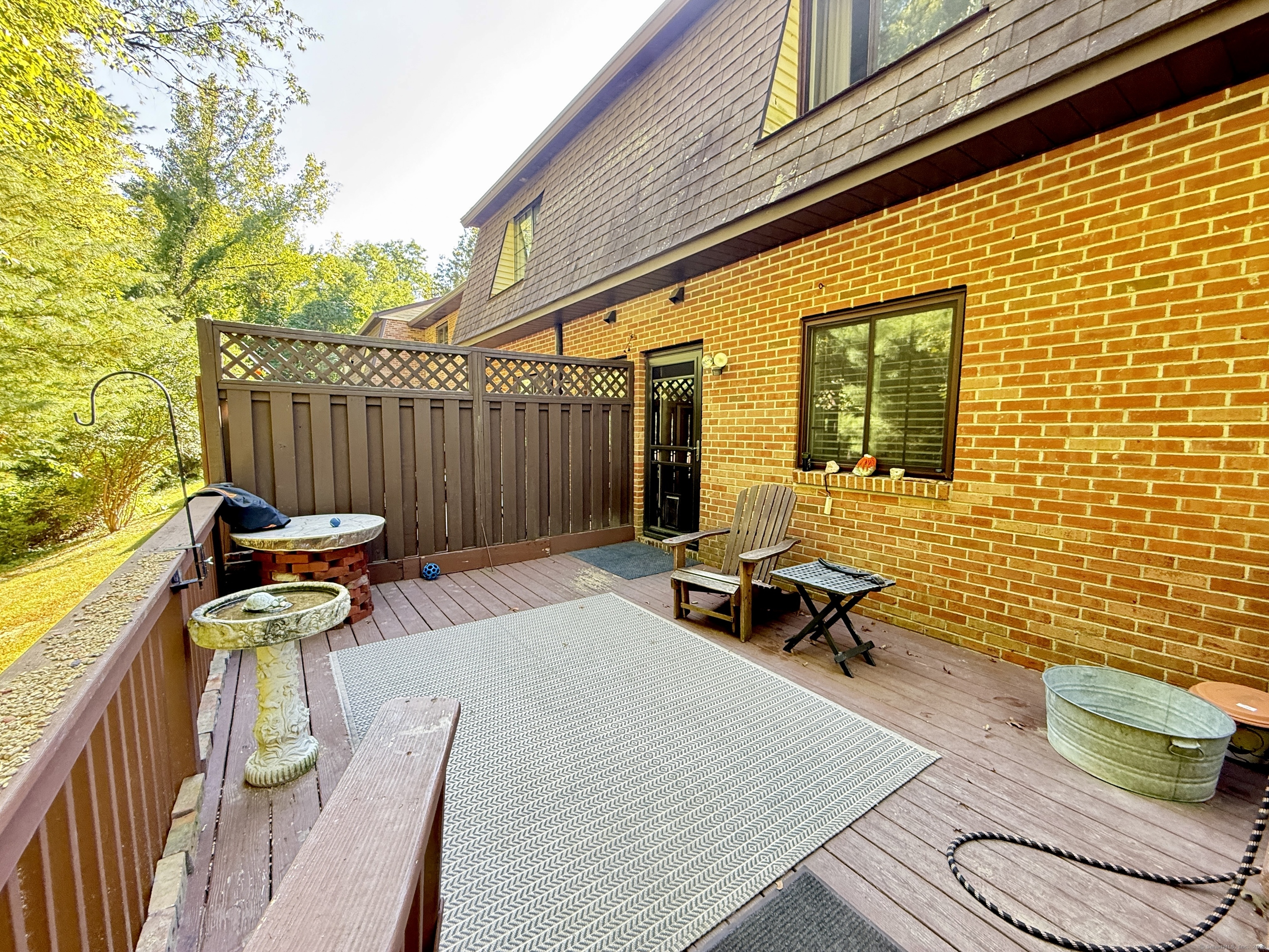 143 Pine Hill Road, Unit 15F Thomaston, CT 06787 - Photo 13 of 14 a balcony with chairs and a table