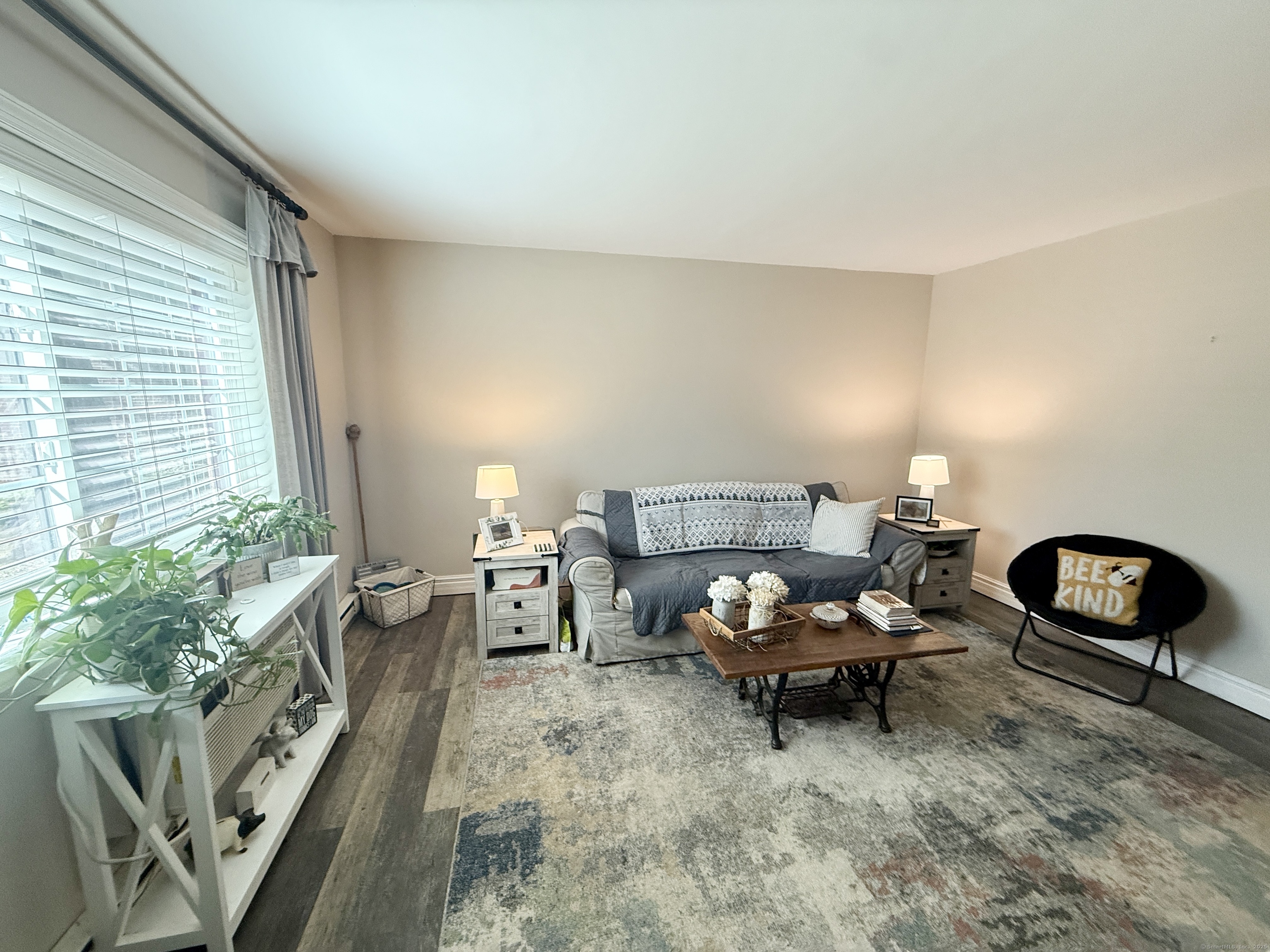 143 Pine Hill Road, Unit 15F Thomaston, CT 06787 - Photo 4 of 14 a living room with furniture and a potted plant