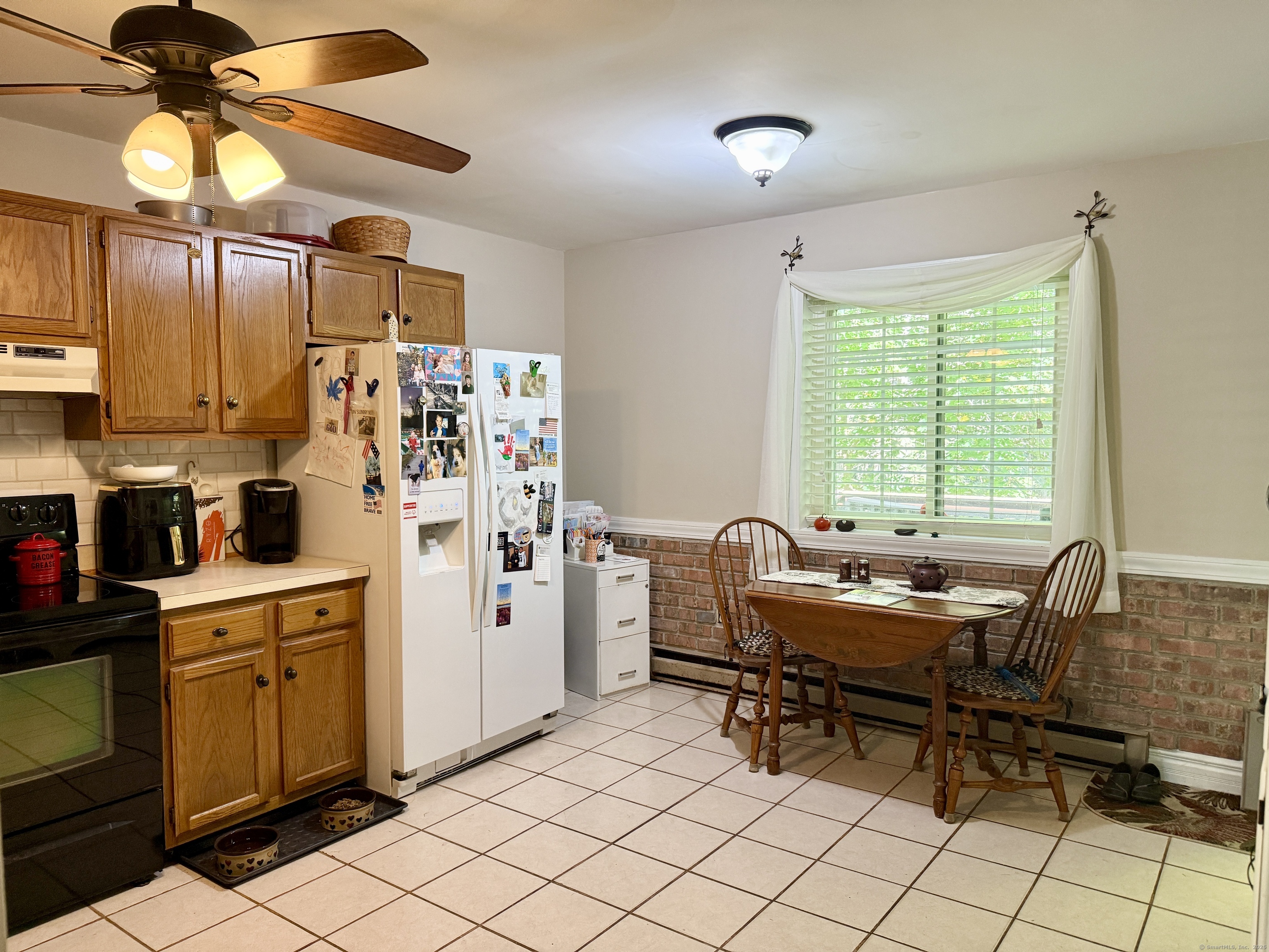 143 Pine Hill Road, Unit 15F Thomaston, CT 06787 - Photo 5 of 14 a view of a workspace with furniture and a window