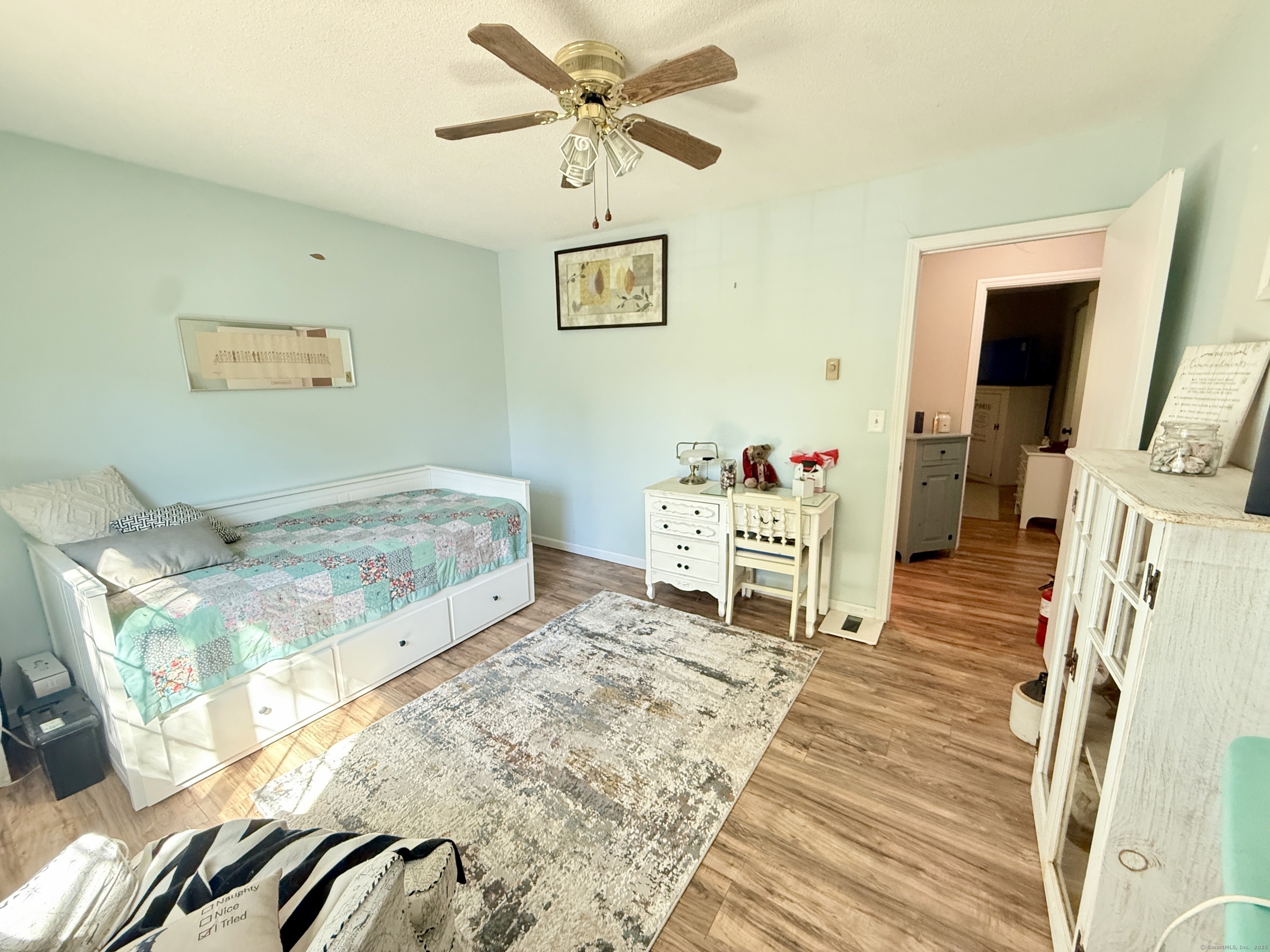 143 Pine Hill Road, Unit 15F Thomaston, CT 06787 - Photo 9 of 14 a living room with furniture and a flat screen tv