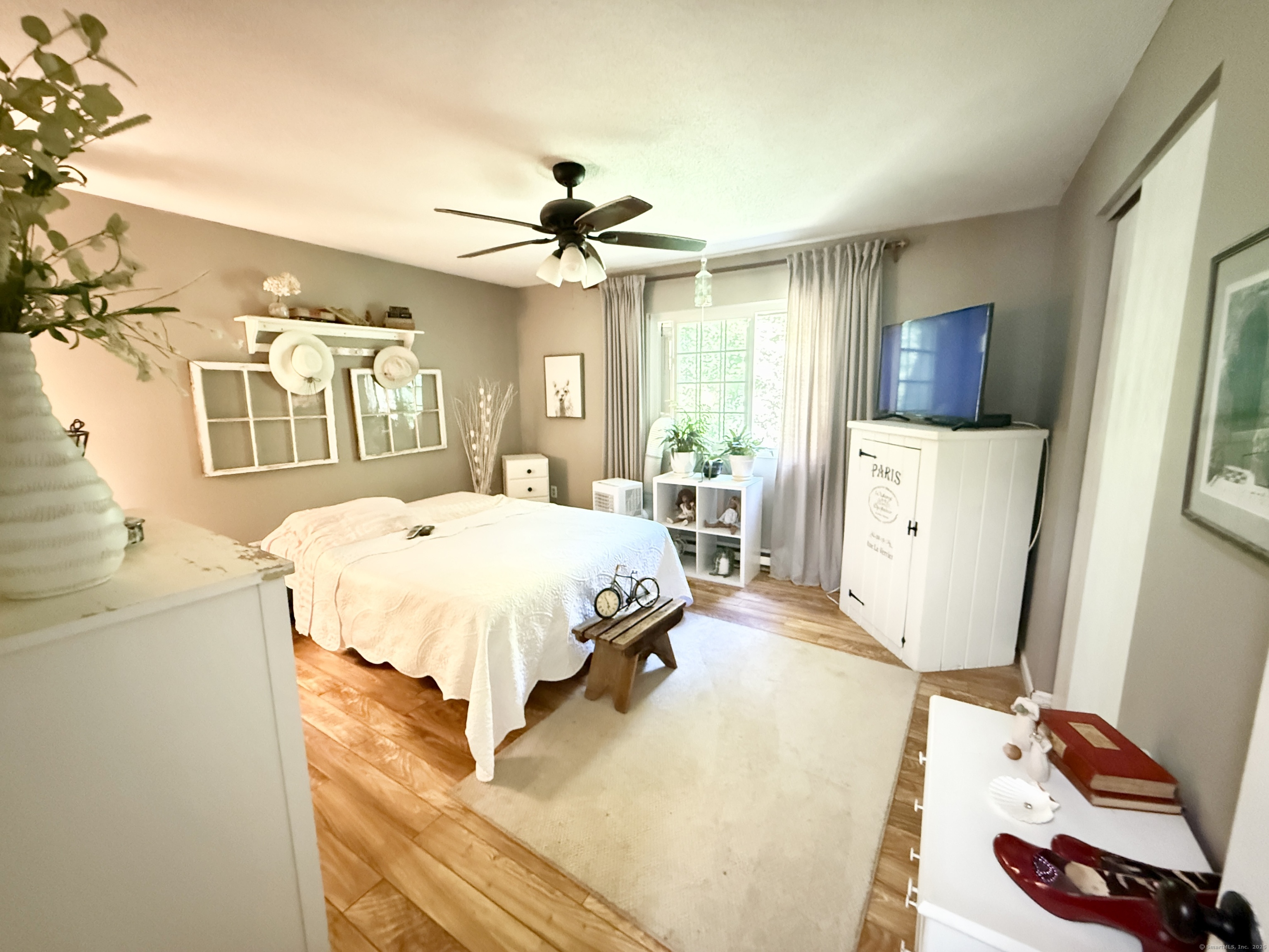 143 Pine Hill Road, Unit 15F Thomaston, CT 06787 - Photo 10 of 14 a bed room with a bed mirror and a window