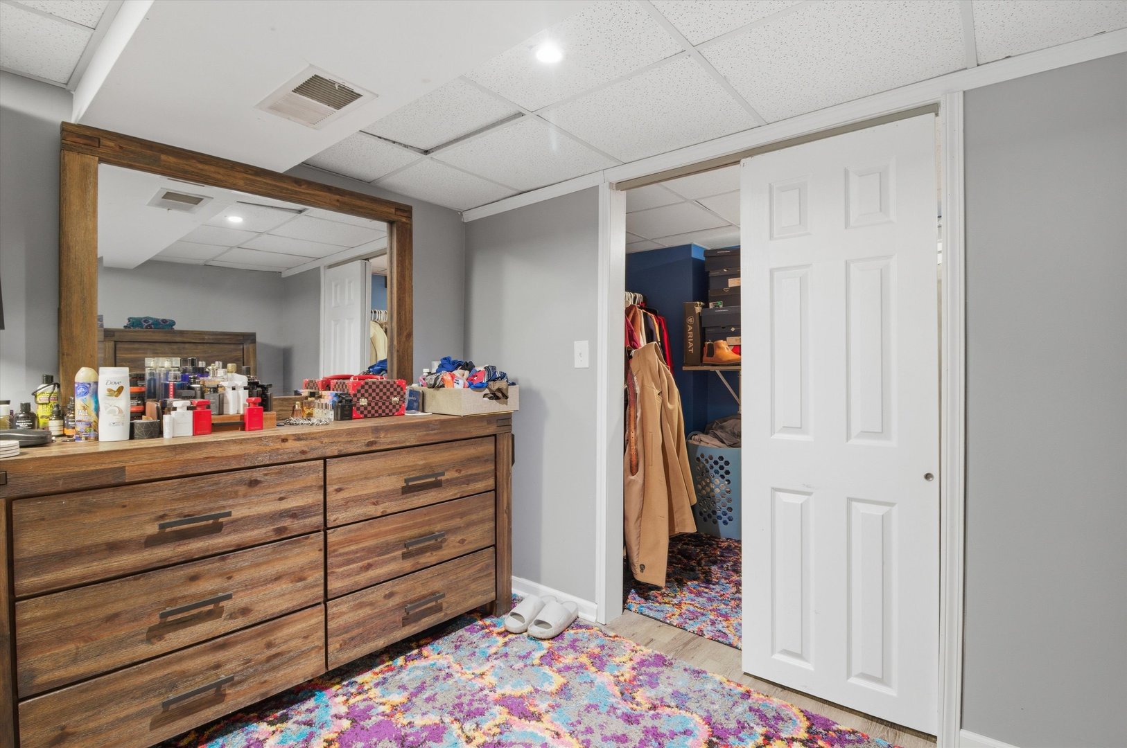 1107 West 101st Street Chicago, IL 60643 - Photo 21 of 28 a bed room with a bed and a mirror