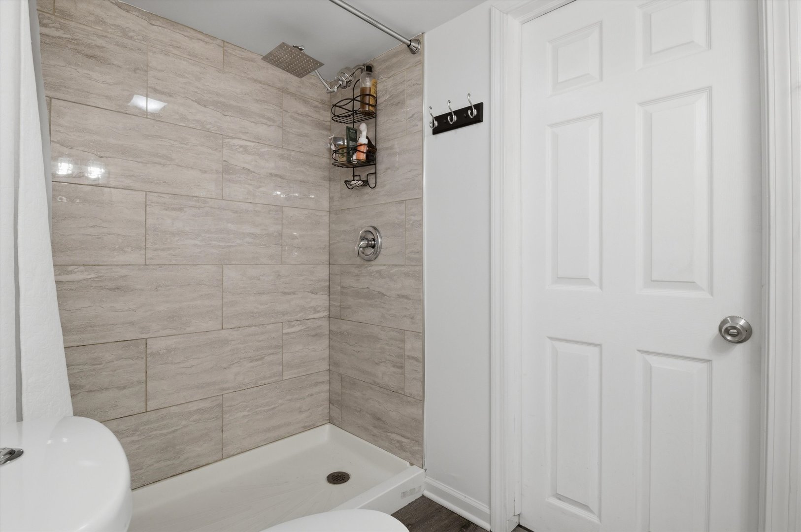 1107 West 101st Street Chicago, IL 60643 - Photo 23 of 28 a bathroom with a shower and toilet