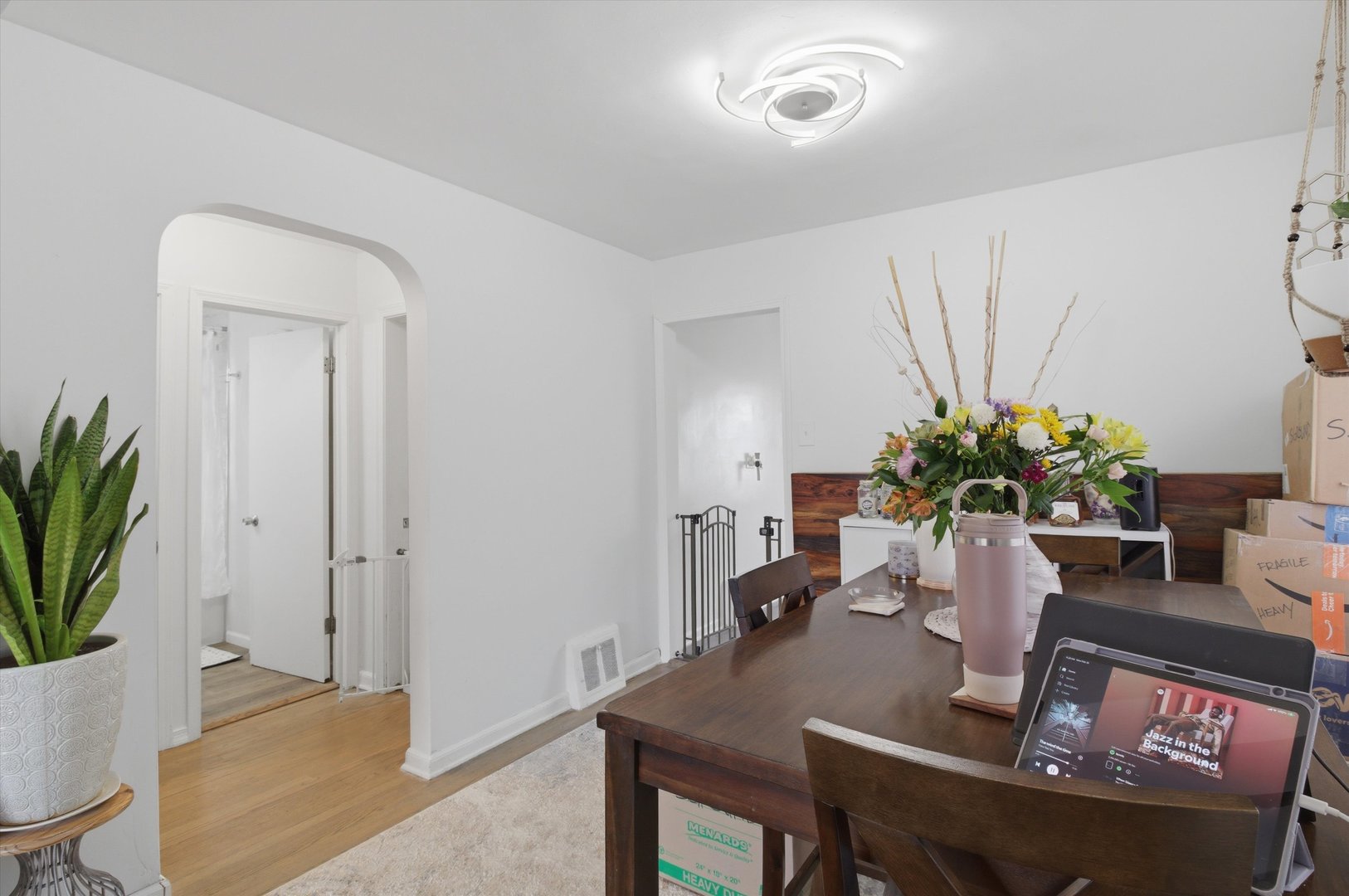 1107 West 101st Street Chicago, IL 60643 - Photo 10 of 28 a view of a dining room with furniture and a potted plant