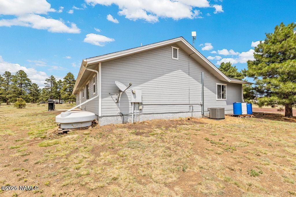 7597 Conley Road Flagstaff, AZ 86004 - Photo 32 of 38 a view of a house with a yard