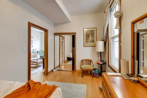 a view of a livingroom with furniture and a large window