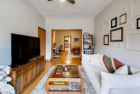 a living room with furniture and a flat screen tv