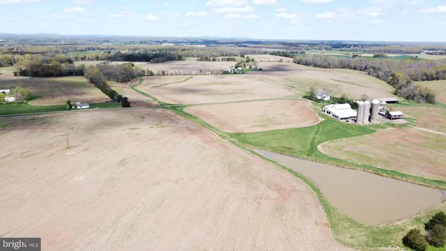 an aerial view of a golf course with parking space