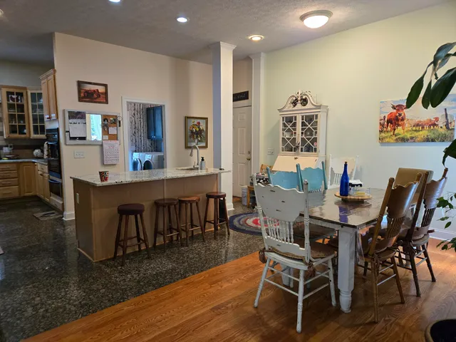 a kitchen with stainless steel appliances a stove and cabinets