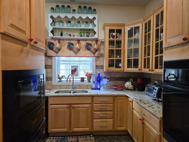 a living room with furniture rug and window